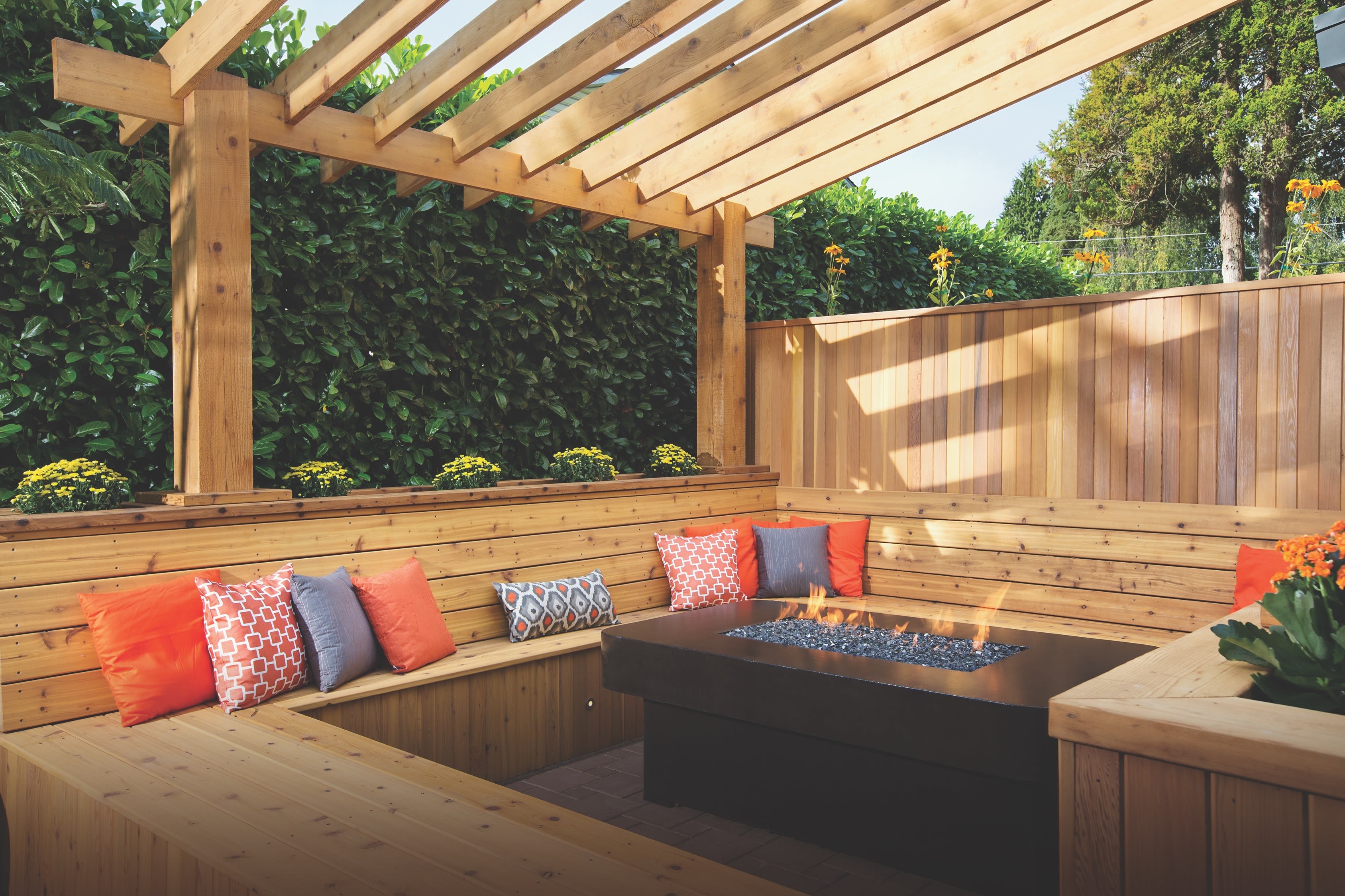 Cedar pergola over outdoor seating area with natural wood beams